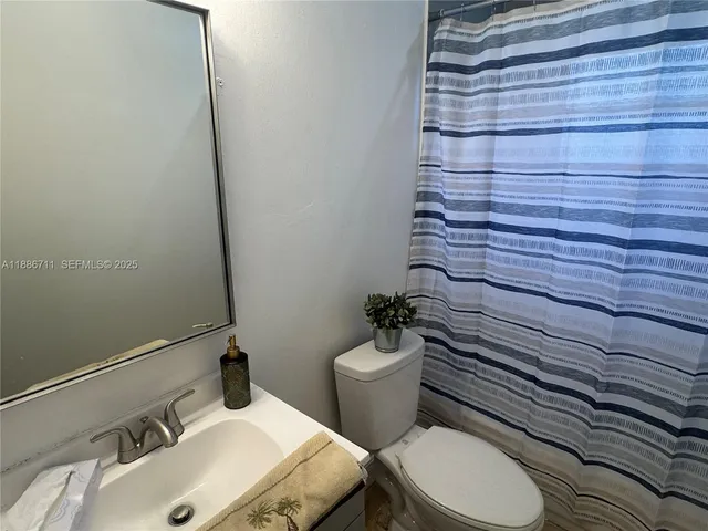 a view of a porch with wooden floor