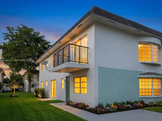 a front view of house and yard with green space
