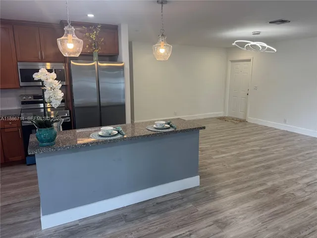 a sink with a potted plant on it