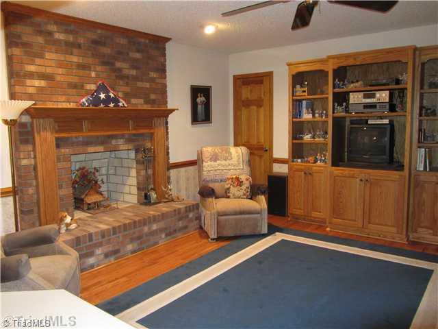 2129 Bethesda Church Road Madison, NC 27025 - Photo 10 of 16 Den/Family/Great Room. Den with Masonry Fireplace