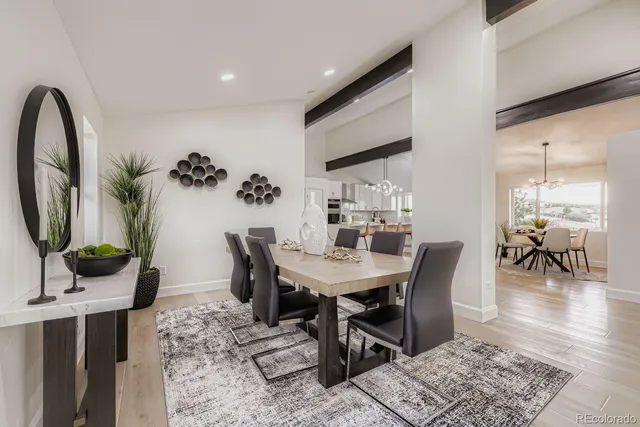 a living room with furniture and large windows