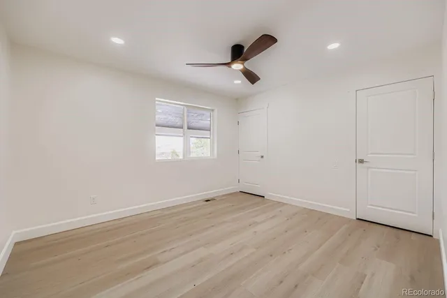 a bathroom with a double vanity sink mirror and shower