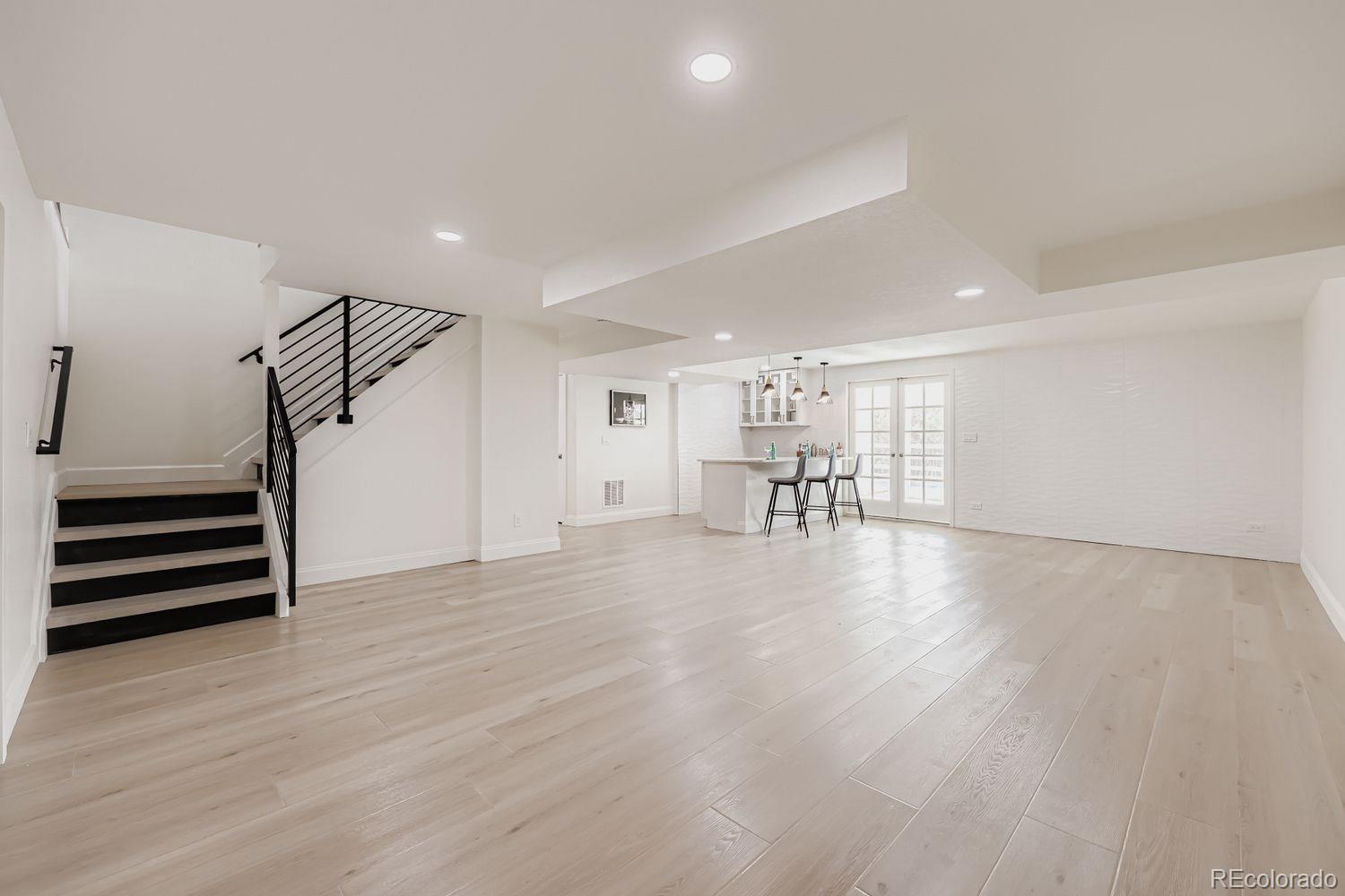 3435 West Dawson Road Sedalia, CO 80135 - Photo 28 of 42 a view of empty room with wooden floor and stairs
