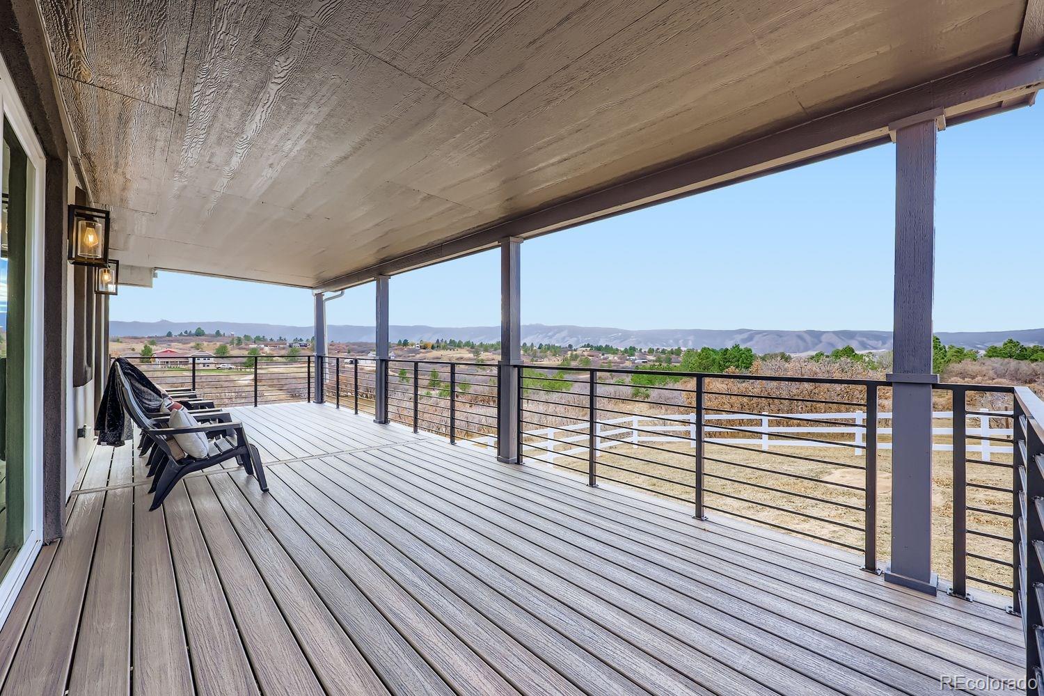 3435 West Dawson Road Sedalia, CO 80135 - Photo 29 of 42 a view of balcony with wooden floor