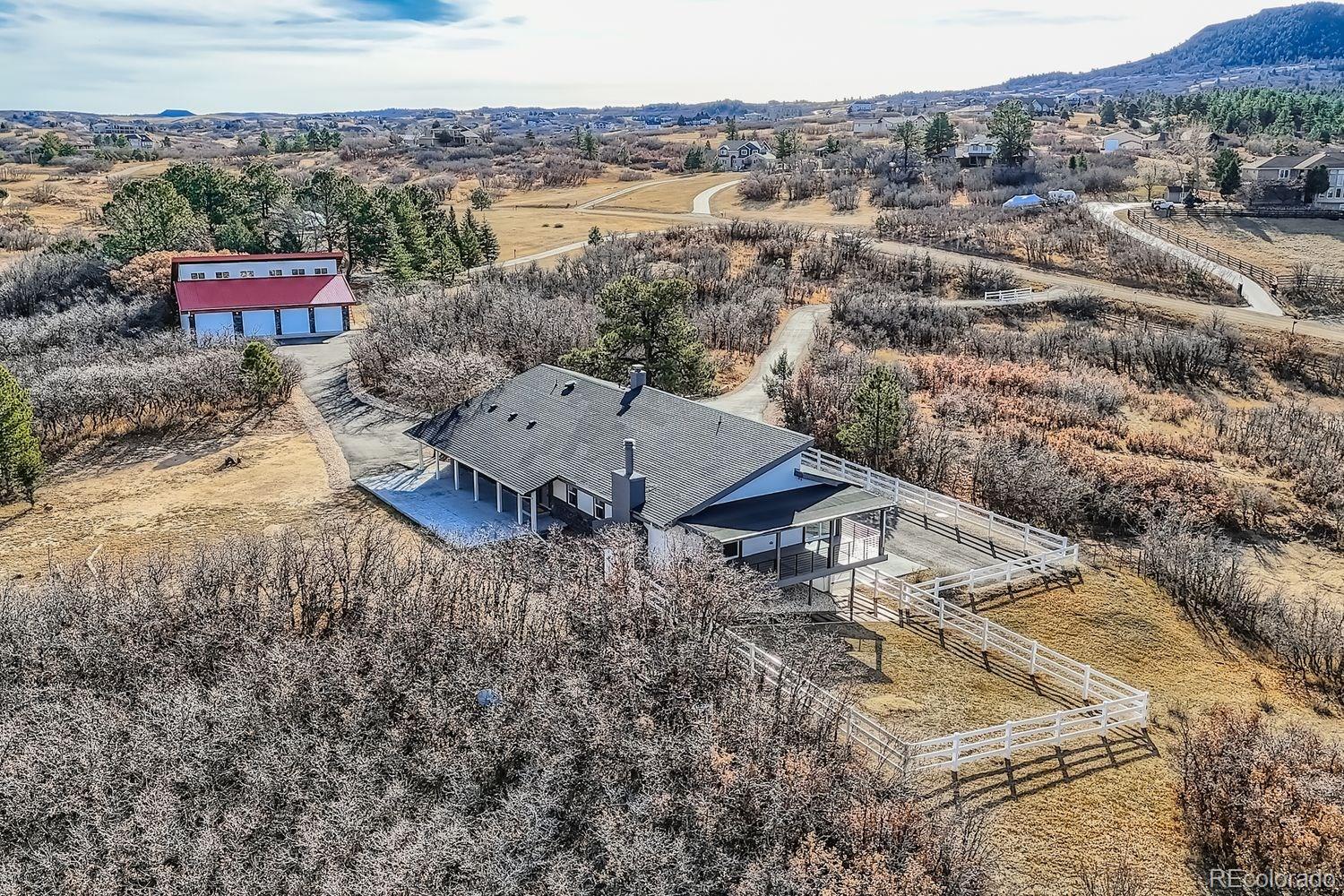 3435 West Dawson Road Sedalia, CO 80135 - Photo 35 of 42 an aerial view of a house with a yard