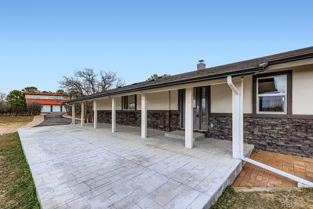 front view of a house with a patio