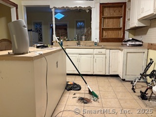 251 Collins Street Hartford, CT 06105 - Photo 5 of 19 a view of a kitchen with appliances and cabinets