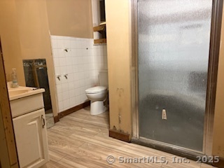 251 Collins Street Hartford, CT 06105 - Photo 7 of 19 a bathroom with a granite countertop shower