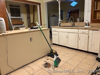 251 Collins Street Hartford, CT 06105 - Photo 9 of 19 a bathroom with a sink and a mirror