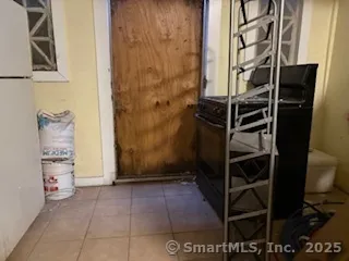 a white toilet sitting next to a sink