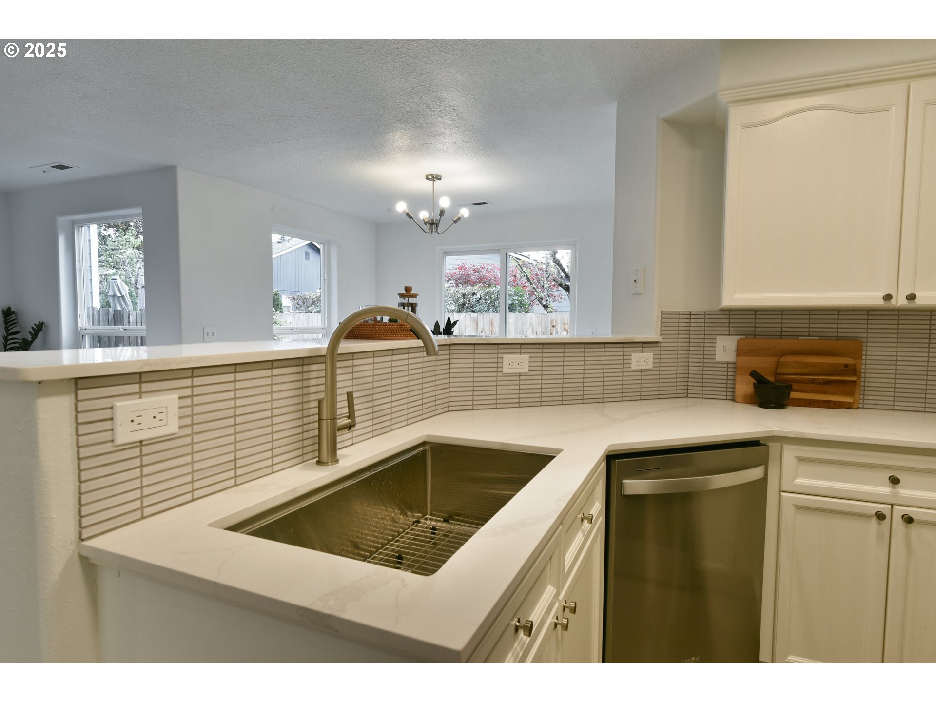 20382 Southwest Monson Street Beaverton, OR 97003 - Photo 13 of 28 a kitchen with a sink and cabinets