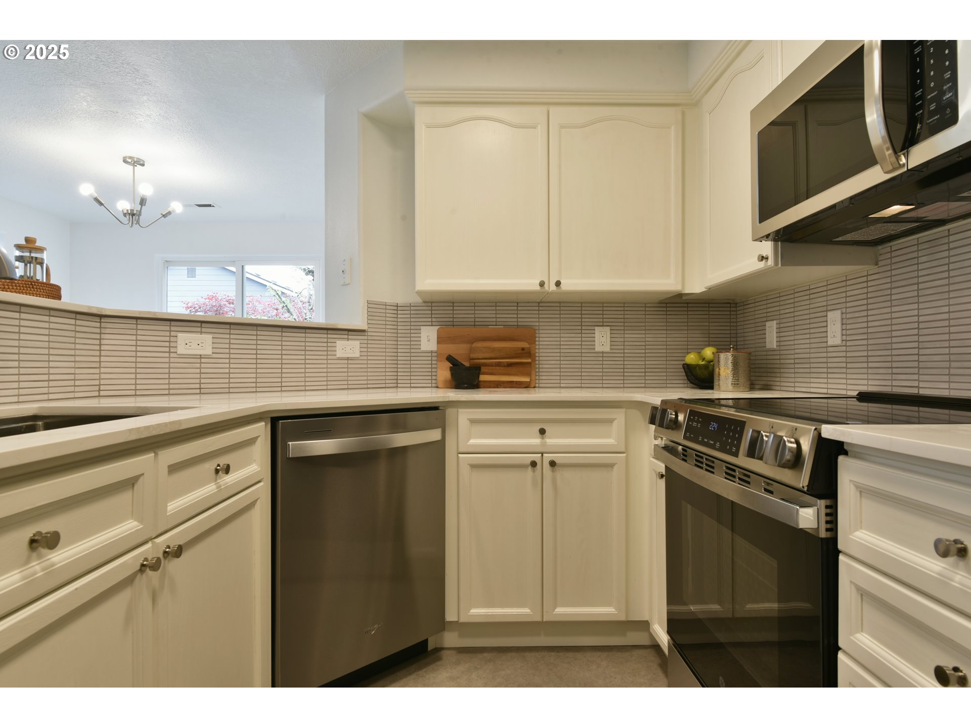 20382 Southwest Monson Street Beaverton, OR 97003 - Photo 14 of 28 a kitchen with a sink cabinets and appliances