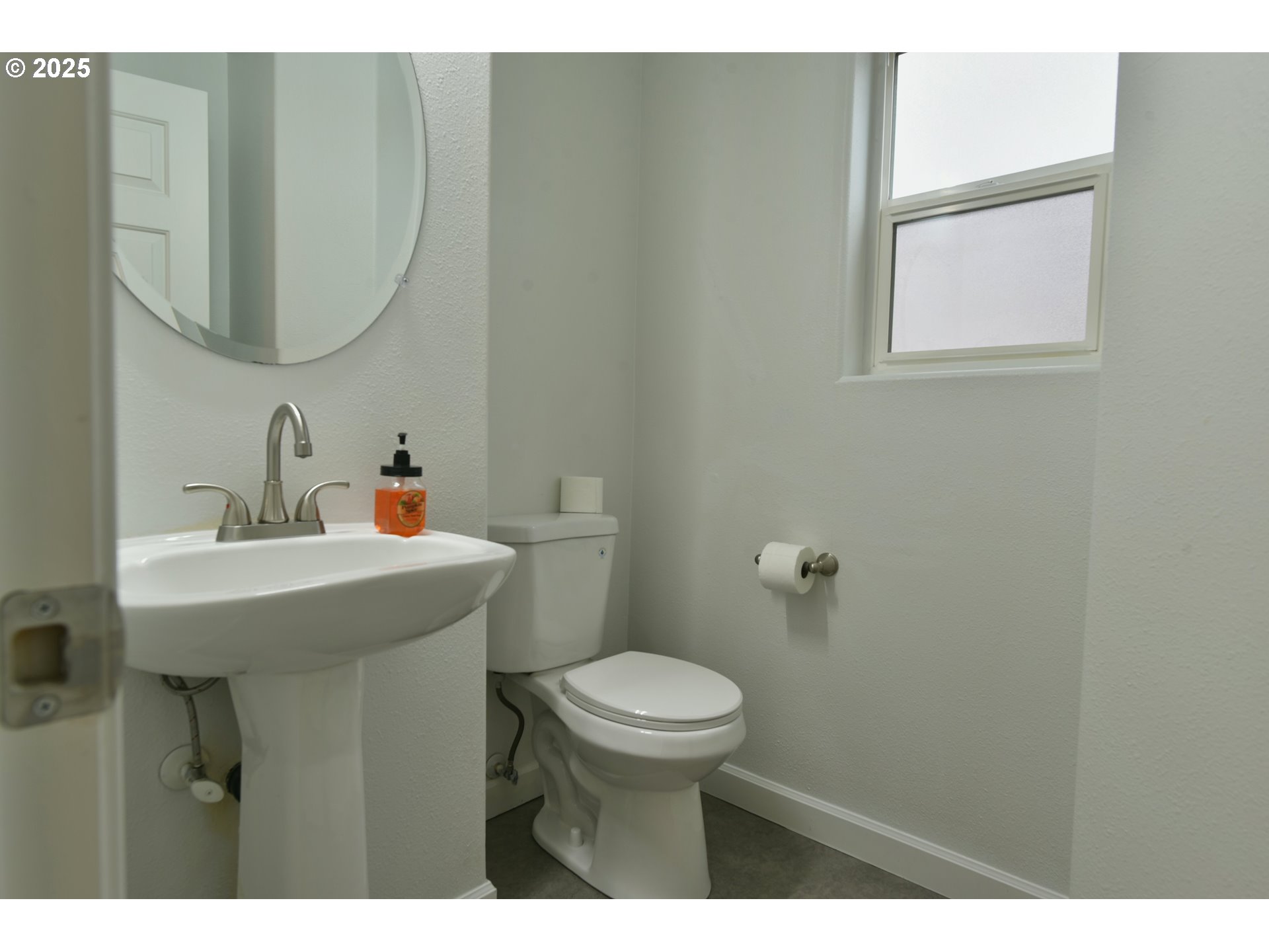 20382 Southwest Monson Street Beaverton, OR 97003 - Photo 16 of 28 a bathroom with a sink a toilet and a mirror