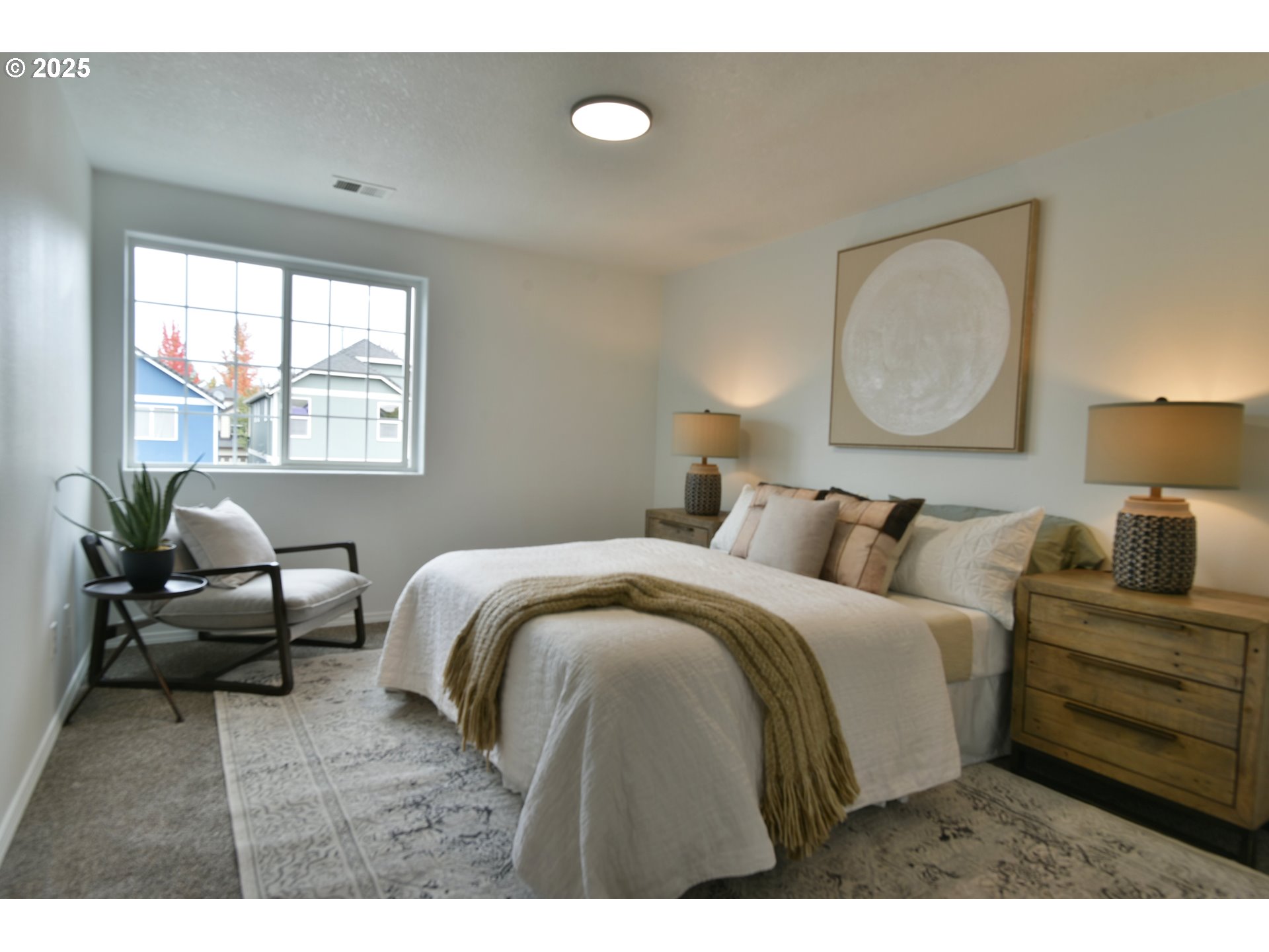 20382 Southwest Monson Street Beaverton, OR 97003 - Photo 17 of 28 a bedroom with a bed and wooden floor