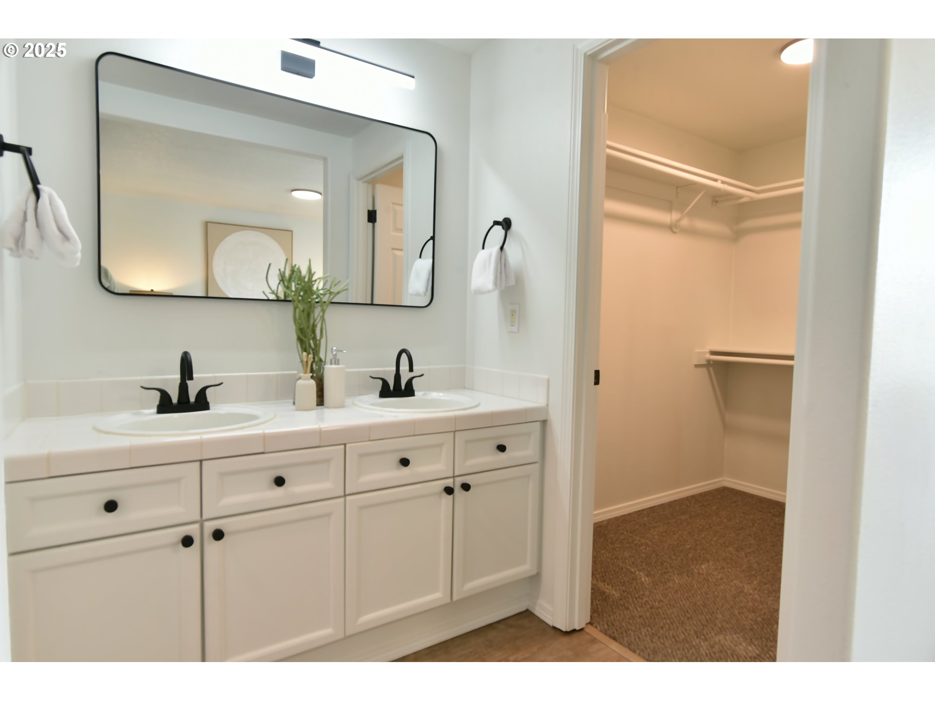 20382 Southwest Monson Street Beaverton, OR 97003 - Photo 18 of 28 a bathroom with a double vanity sink mirror and