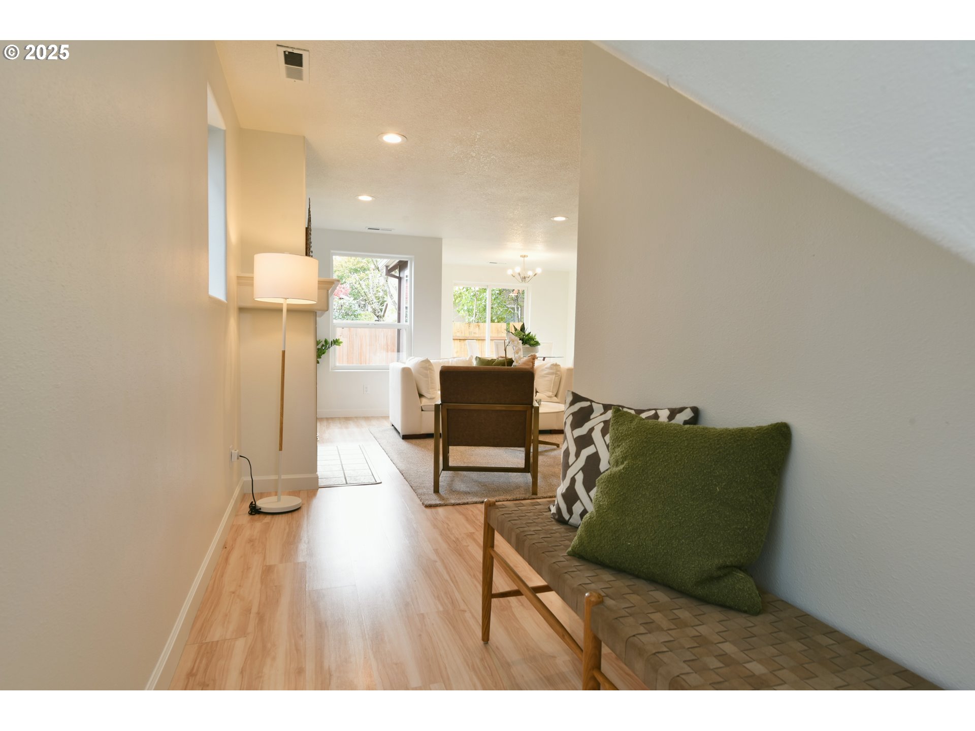 20382 Southwest Monson Street Beaverton, OR 97003 - Photo 2 of 28 a living room with furniture and a wooden floor