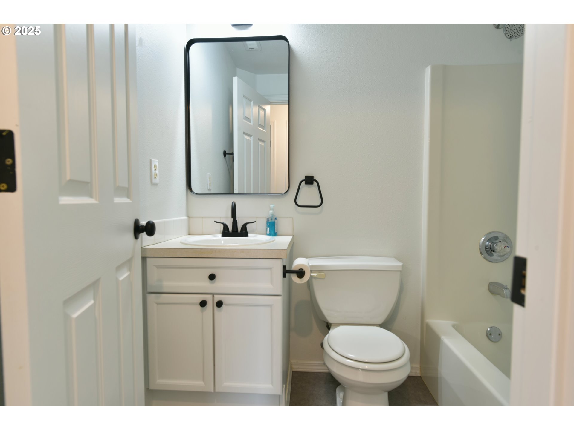 20382 Southwest Monson Street Beaverton, OR 97003 - Photo 25 of 28 a bathroom with a toilet sink and mirror