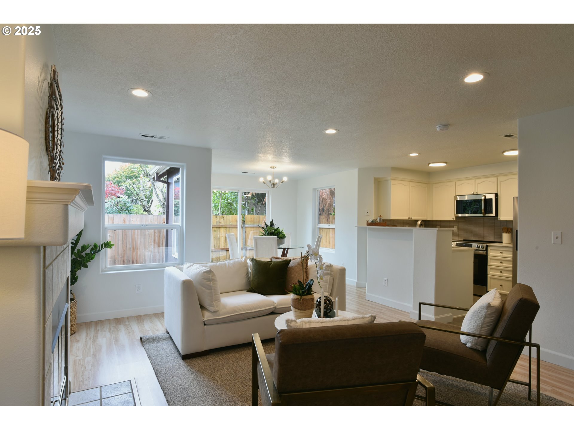 20382 Southwest Monson Street Beaverton, OR 97003 - Photo 3 of 28 a living room with furniture and a wooden floor