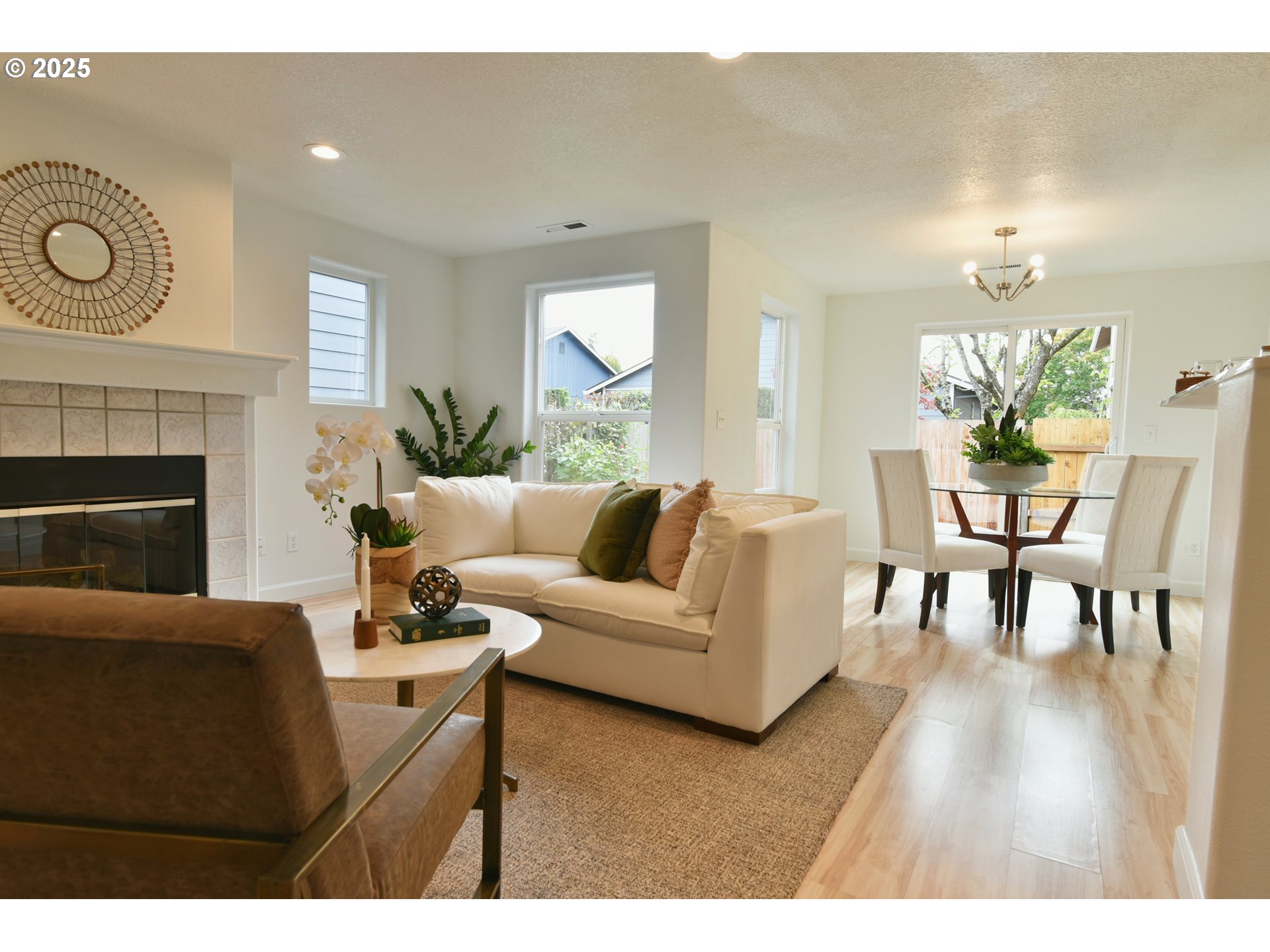 20382 Southwest Monson Street Beaverton, OR 97003 - Photo 6 of 28 a living room with furniture a fireplace and a table