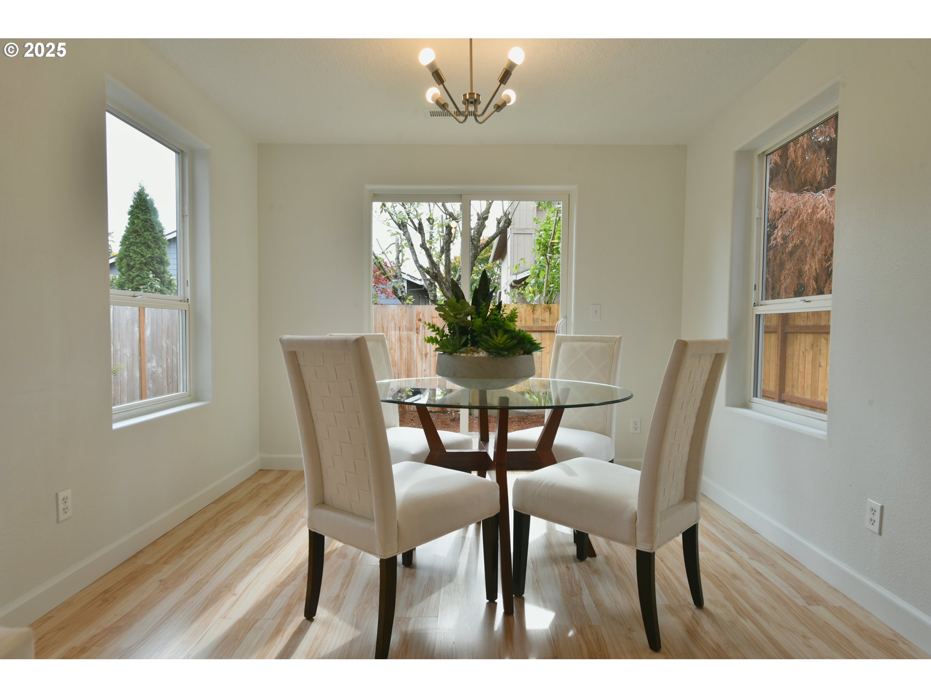 20382 Southwest Monson Street Beaverton, OR 97003 - Photo 7 of 28 a view of a dining room with furniture and wooden floor