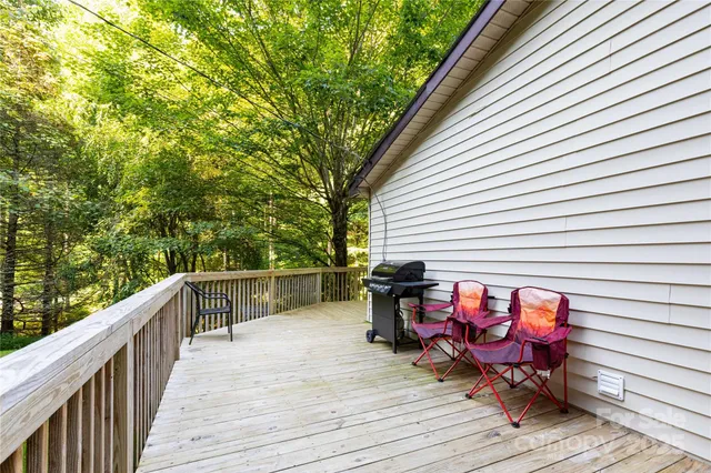 a view of a patio with wooden floor and furniture