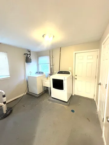 a utility room with washer and dryer