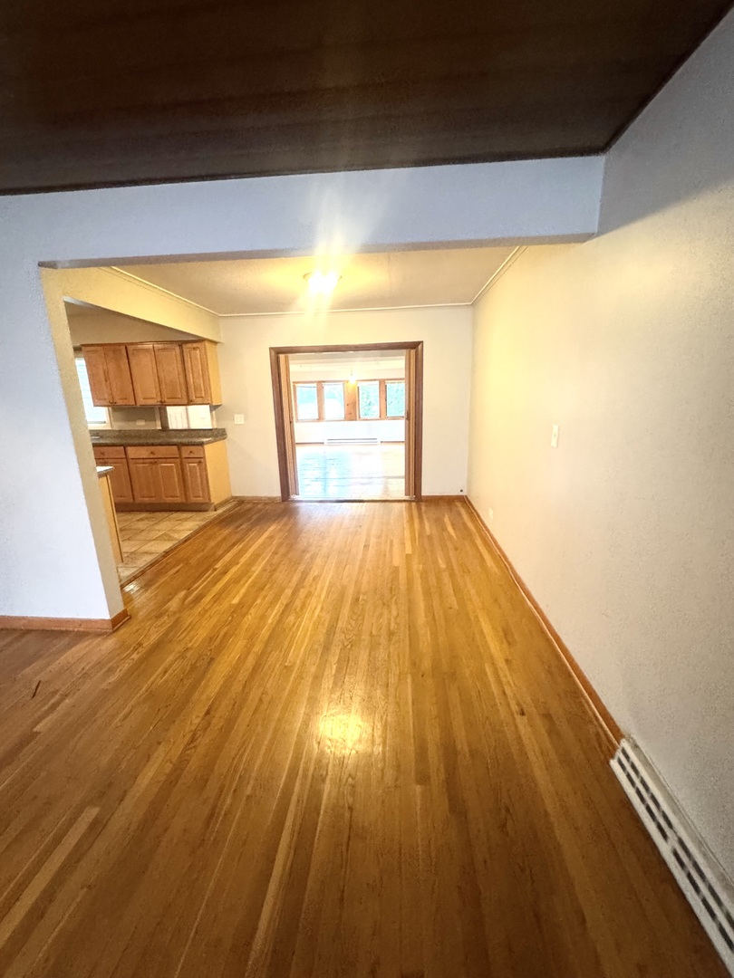 1834 Terrace Road Homewood, IL 60430 - Photo 5 of 21 a view of empty room with wooden floor and fan