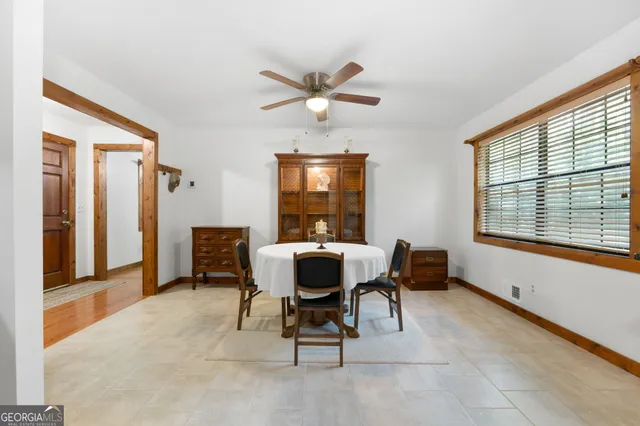 a bedroom with bed and window