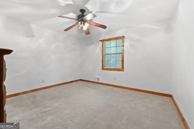wooden floor in an empty room with a mirror