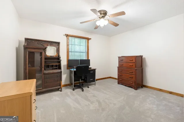 a view of room with workspace and a window