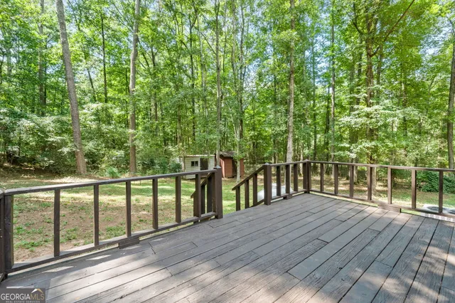 a backyard of a house with a yard and outdoor seating