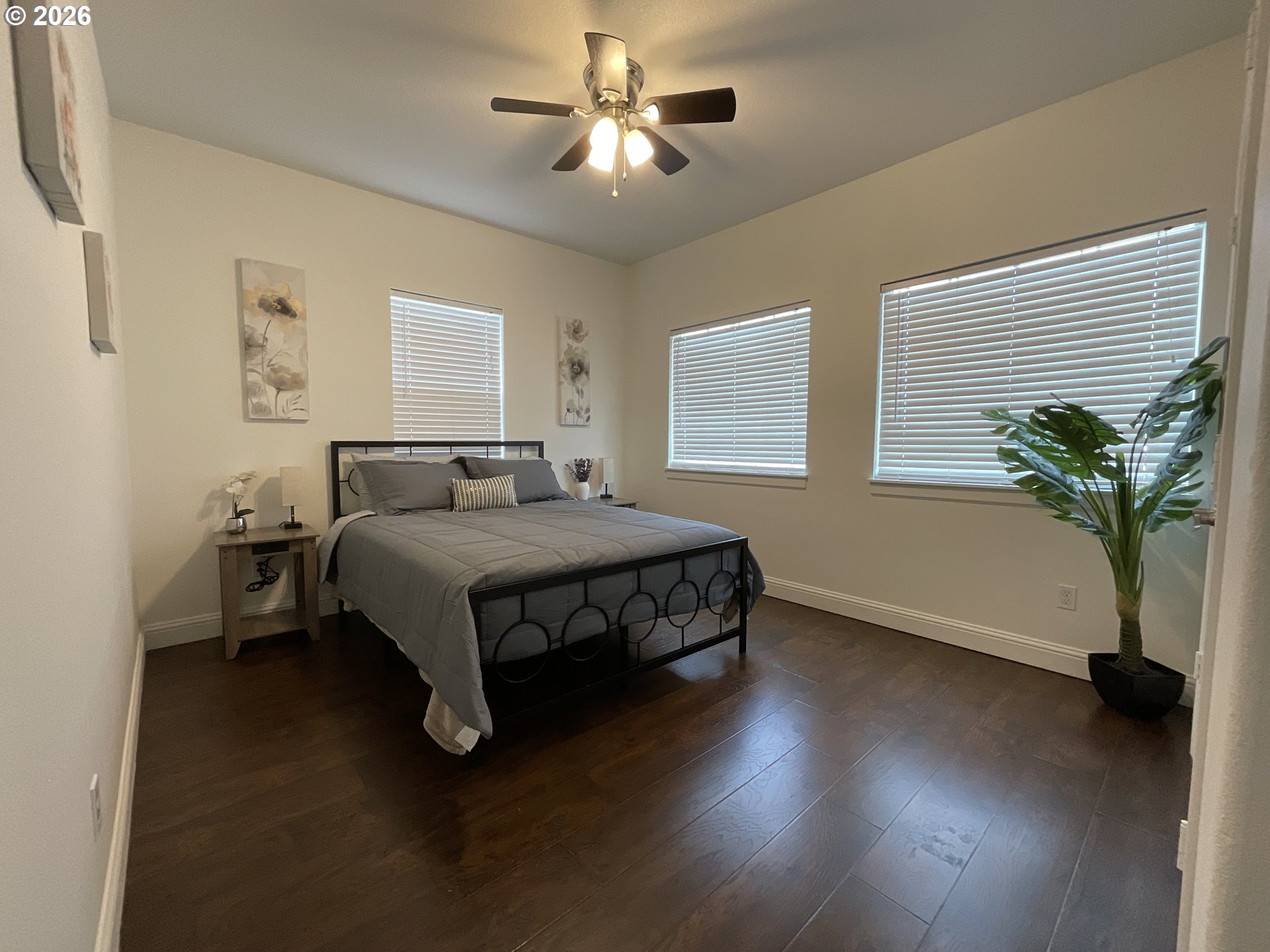 1310 Gales Creek Road Forest Grove, OR 97116 - Photo 18 of 39 a bedroom with a bed and a potted plant