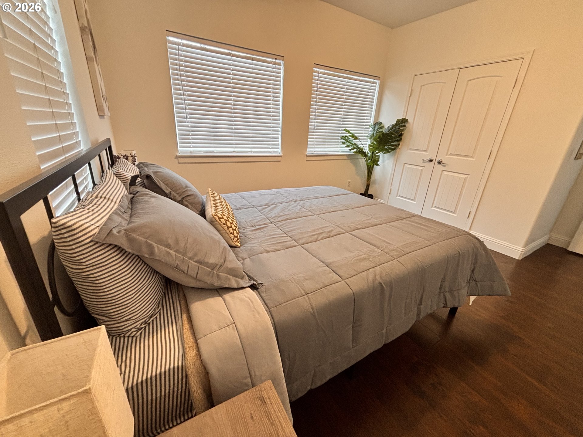 1310 Gales Creek Road Forest Grove, OR 97116 - Photo 19 of 39 a bedroom with a bed and wooden floor
