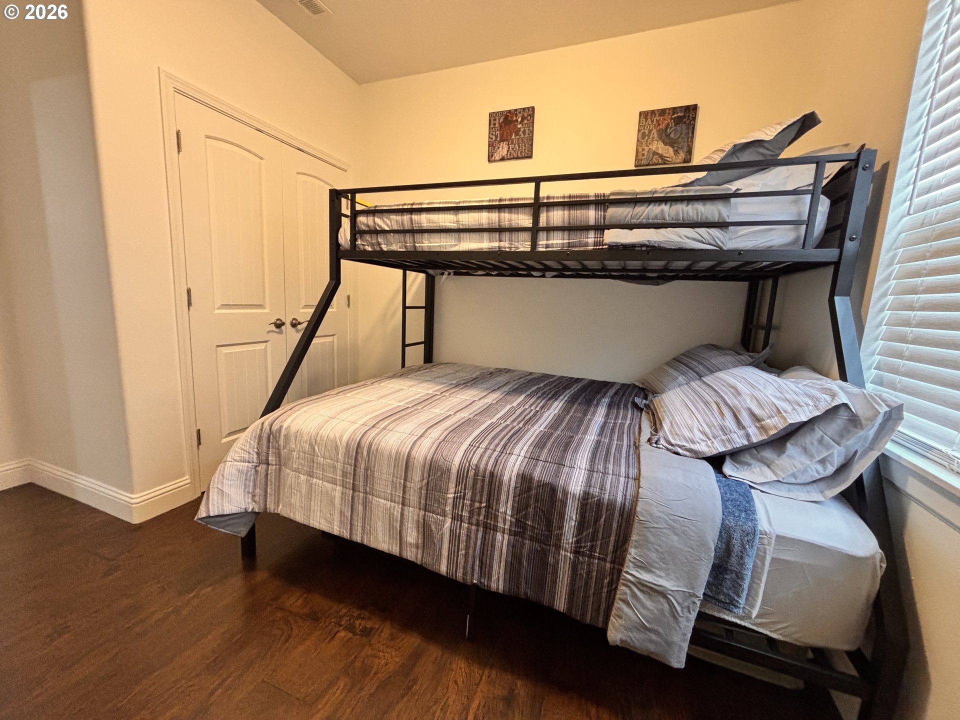 1310 Gales Creek Road Forest Grove, OR 97116 - Photo 22 of 39 a bedroom with a bed and wooden floor