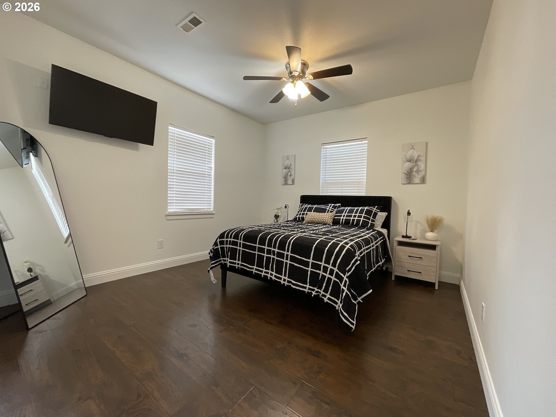1310 Gales Creek Road Forest Grove, OR 97116 - Photo 24 of 39 a bedroom with a bed and a flat screen tv