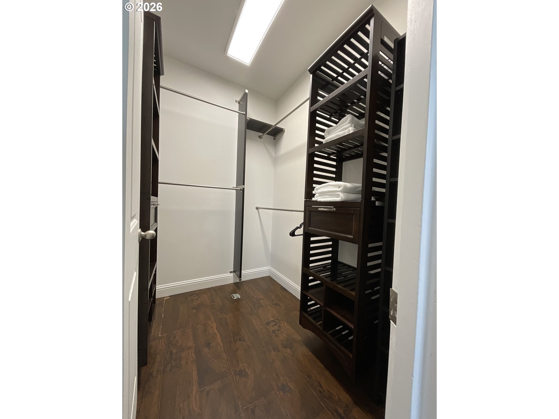 1310 Gales Creek Road Forest Grove, OR 97116 - Photo 28 of 39 a close view of walk in closet with clothes