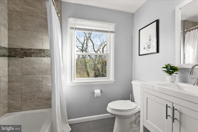a bathroom with a bathtub and shower