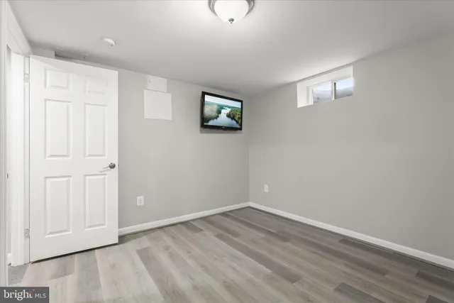 a view of a dining room with furniture large windows and wooden floor