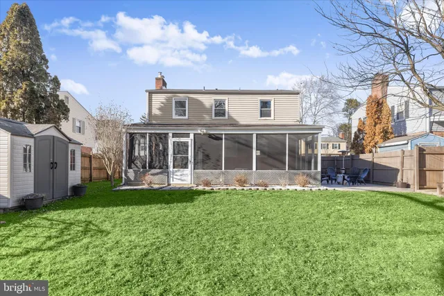 a view of a patio with a table and chairs
