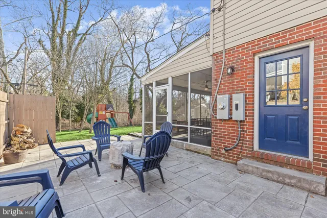 a view of a patio with a table and chairs