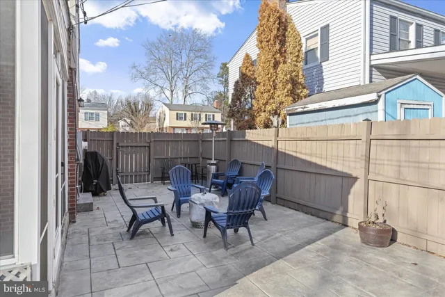 a picture of a bench in front of a wall