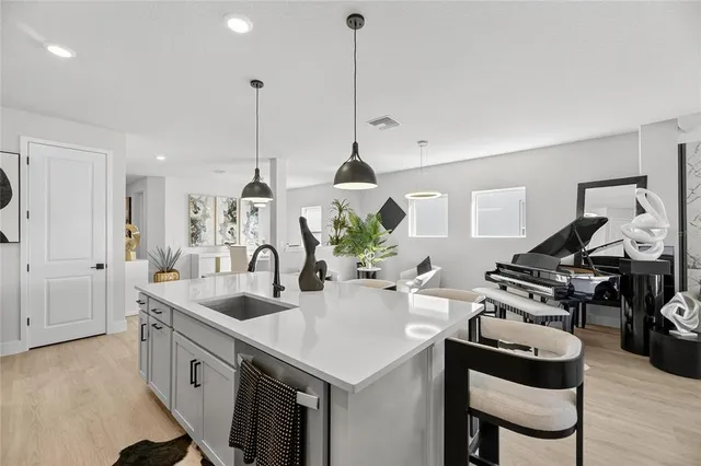 a living room with fireplace furniture and a flat screen tv