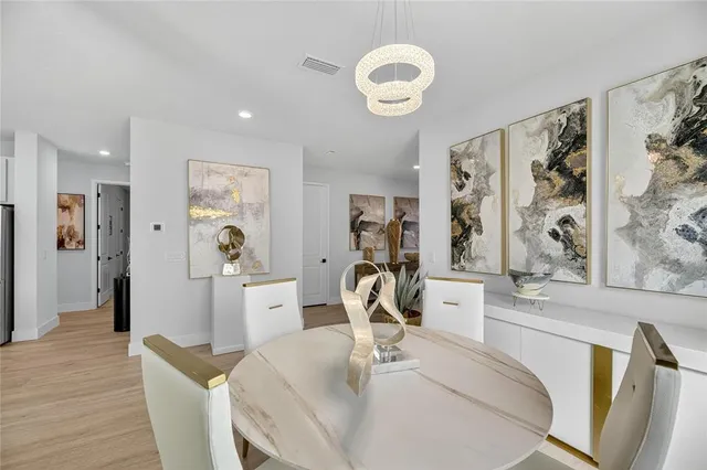 a view of walk in closet with clothes