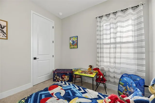 a view of a house with a big yard and large window