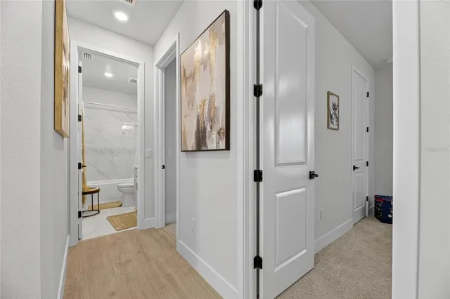 an aerial view of residential houses with outdoor space and swimming pool