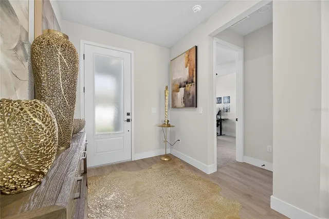 an aerial view of residential houses with outdoor space and swimming pool