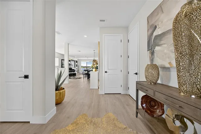 a large kitchen with a table and chairs