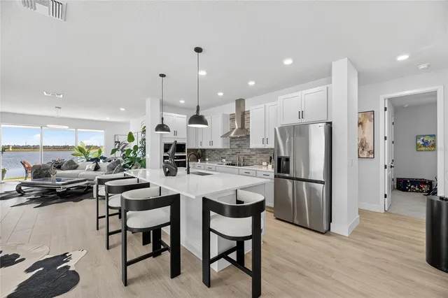 a kitchen with a table and chairs in it