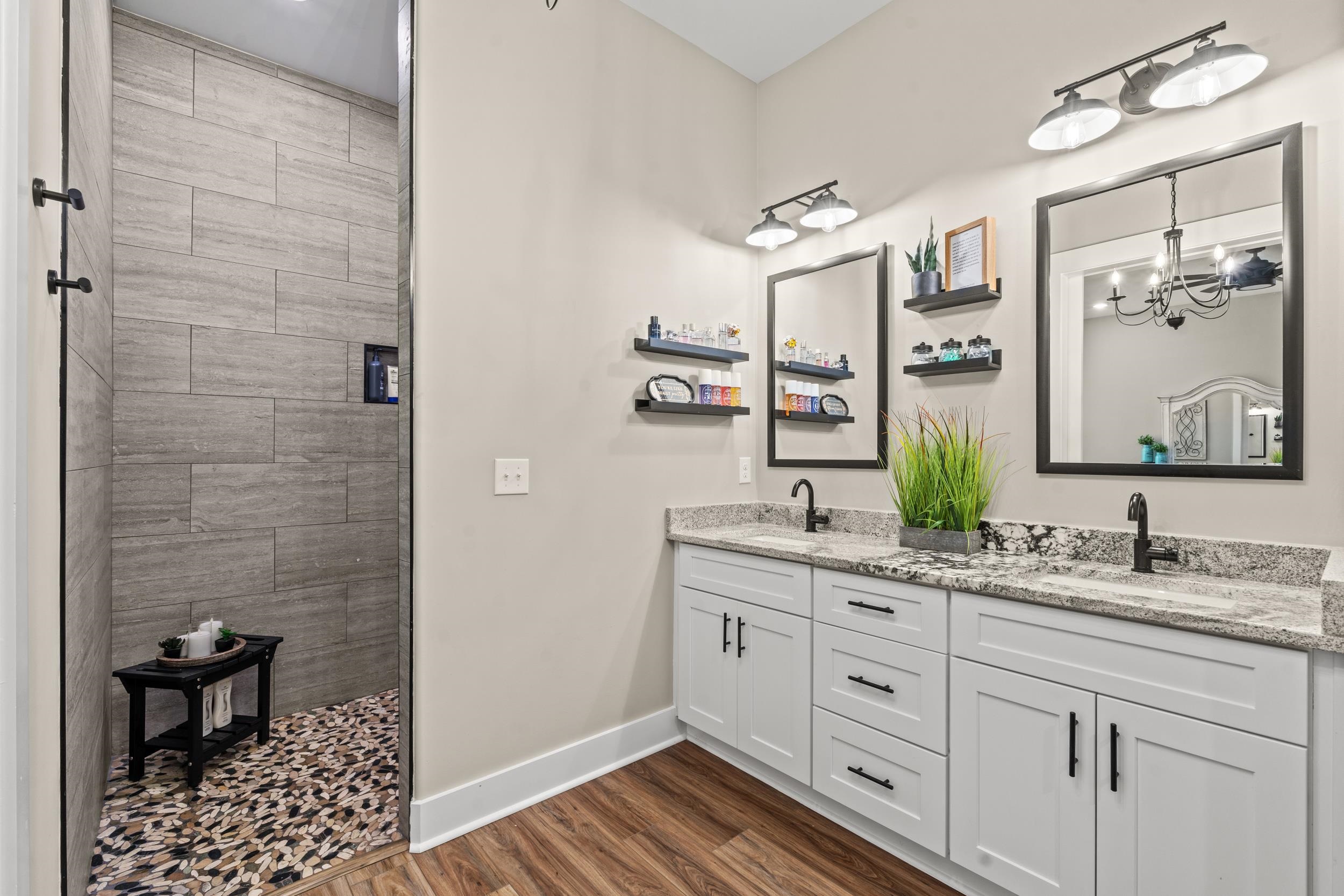 411 Chamberlin Road Myrtle Beach, SC 29588 - Photo 19 of 40 Full bath featuring double vanity, a shower stall, and dark wood-style floors