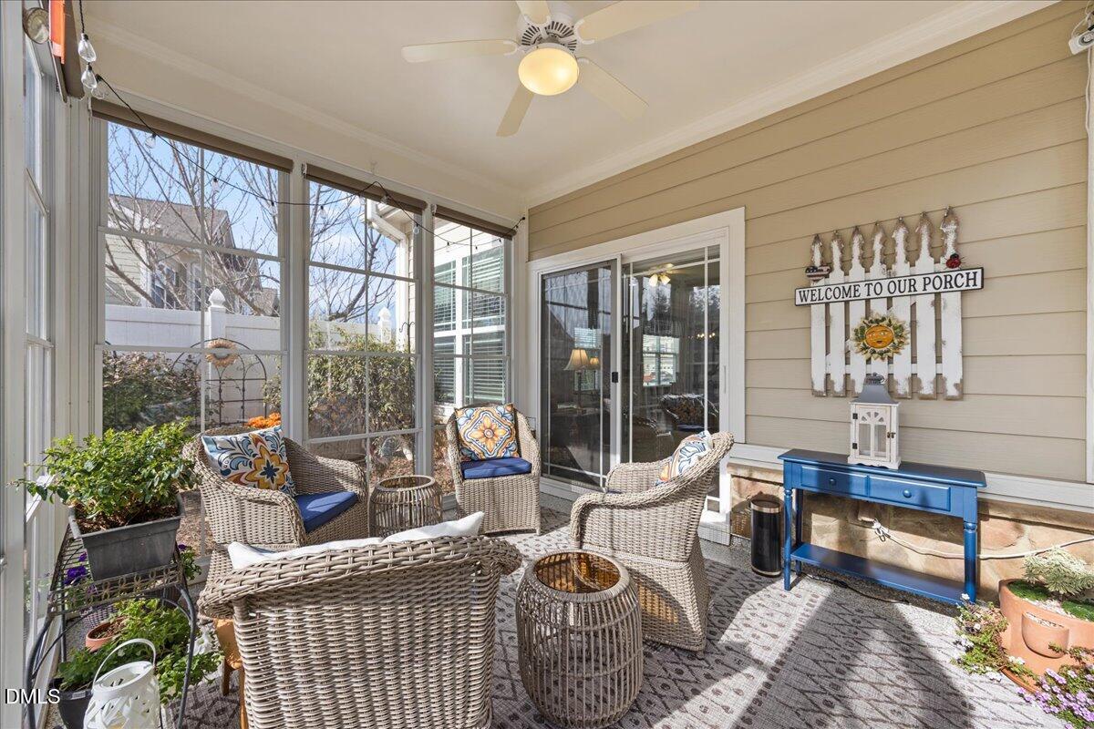 216 Mayfield Drive Apex, NC 27539 - Photo 37 of 66 a living room with furniture and a floor to ceiling window